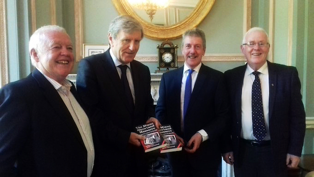The Irish Ambassador to the USA receives ‘The Miami Showband Massacre: A Survivor’s Search for the Truth’ from Stephen Travers with Michael O’Hare (left) and Eugene Reavey (right)