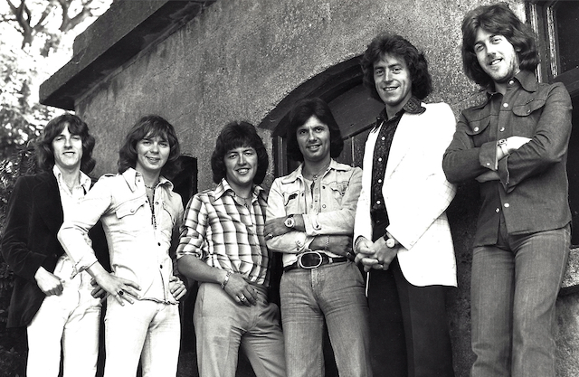 Photo of The Miami Showband standing together, smiling